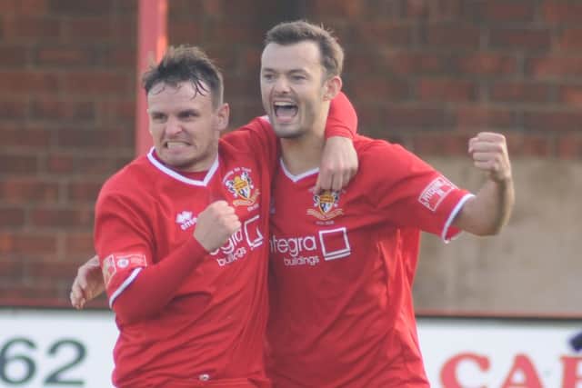 Matty Dixon, left in action for Bridlington Town, has joined Tadcaster
