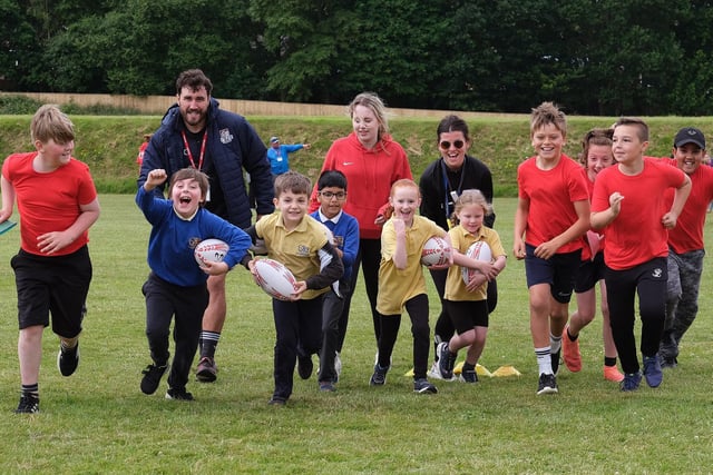 The primary school pupils enjoy rugby