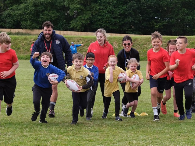 The primary school pupils enjoy rugby