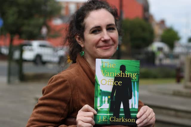 Jayne Clarkson is pictured with a copy of ‘The Vanishing Office’.