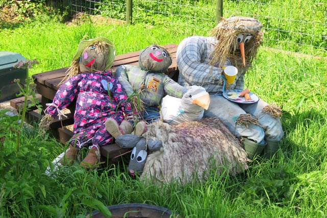 Scarecrow family make hay while the sunshines.