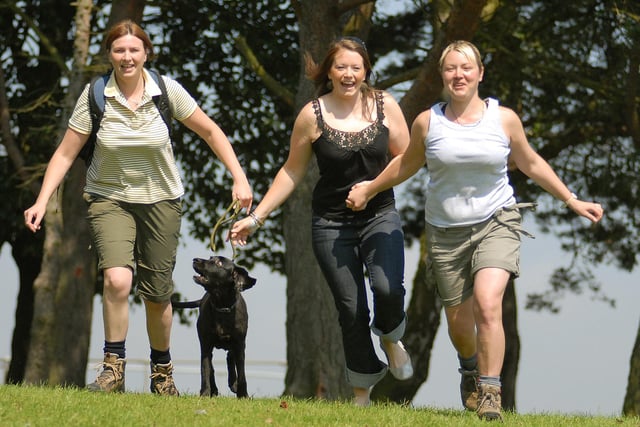 Preparing for the Lyke Wake Walk. Pictured is Rhian Carruthers taking a walk with Damson the dog, and pals Gemma Hindhaugh and Sarah Umpleby.