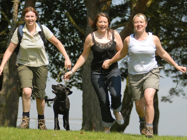 Preparing for the Lyke Wake Walk. Pictured is Rhian Carruthers taking a walk with Damson the dog, and pals Gemma Hindhaugh and Sarah Umpleby.