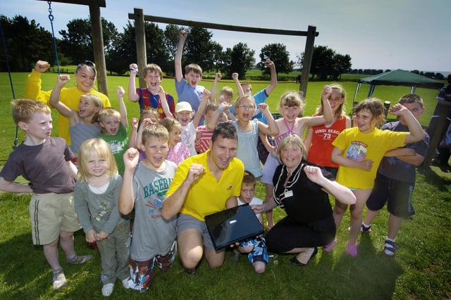 Seamer Skids children's club receives a laptop thanks to the Yorkshire Building Society. Maxine Hartley is pictured front with play leaders Gary Hindle and Katie Brewins and the children from the group.