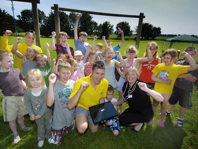 Seamer Skids children's club receives a laptop thanks to the Yorkshire Building Society. Maxine Hartley is pictured front with play leaders Gary Hindle and Katie Brewins and the children from the group.