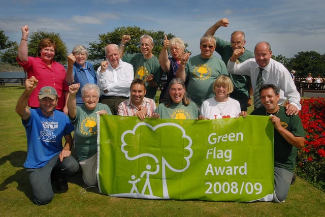 Filey volunteers and supporters cheer as Filey is awarded a Green Flag.