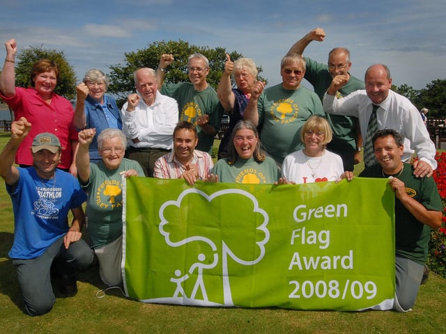 Filey volunteers and supporters cheer as Filey is awarded a Green Flag.