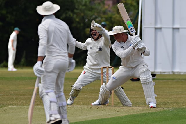 Scarborough keeper Duncan Brown takes a great catch to dismiss Christie