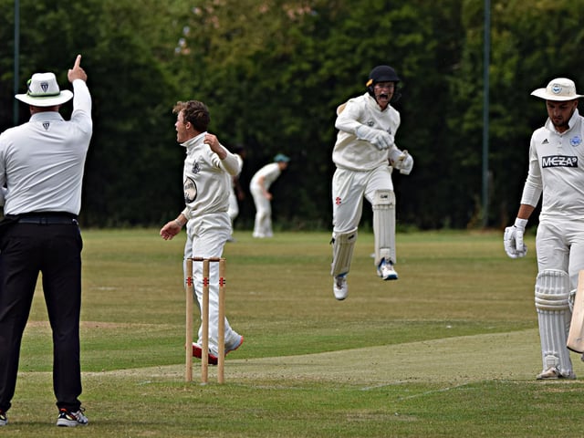 Scarborough CC celebrate claiming the wicket of Christie