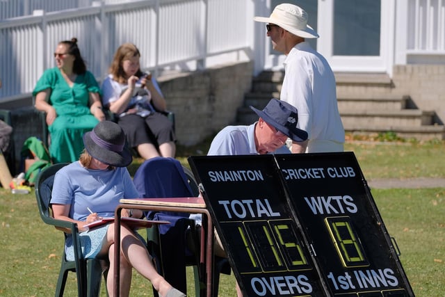 The scorers add up the totals after the home side's innings