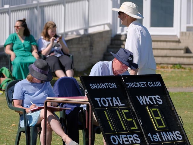 The scorers add up the totals after the home side's innings
