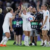 Beth Mead grabs the matchball after her hat-trick in the 8-0 win against Norway