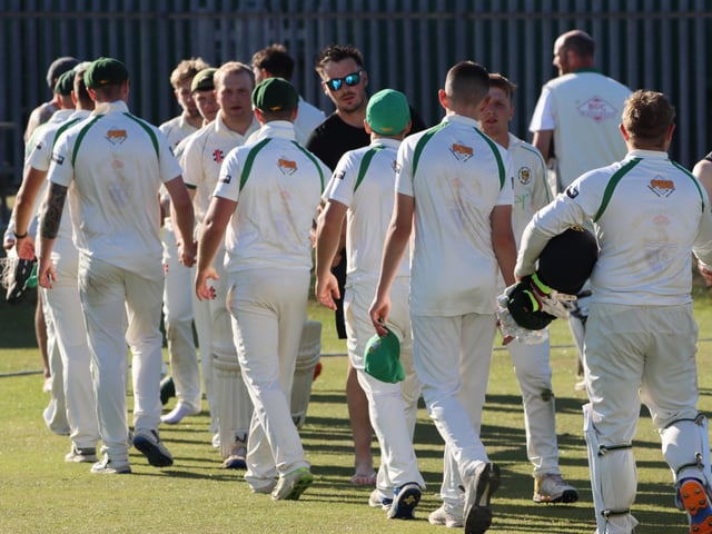 The two teams shake hands at the end of the game