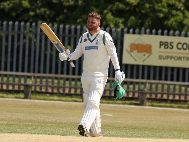 Bridlington CC star John Major raises his bat after reaching his century