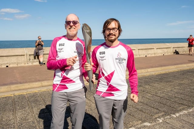 Chris Green and Niall Guite take the baton along Marine Drive.