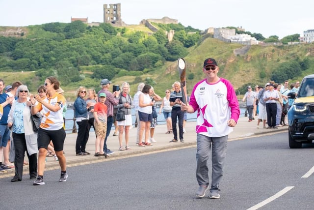 Barry Newman takes part in The Queen's Baton Relay as it visits Scarborough.