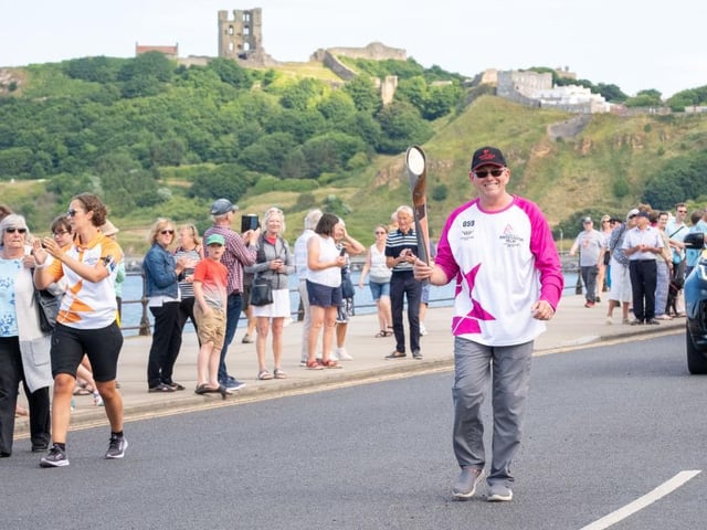 Barry Newman takes part in The Queen's Baton Relay as it visits Scarborough.