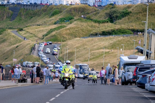 The police escort awaits the baton's arrival.