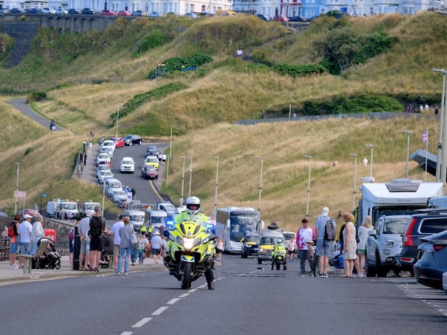 The police escort awaits the baton's arrival.