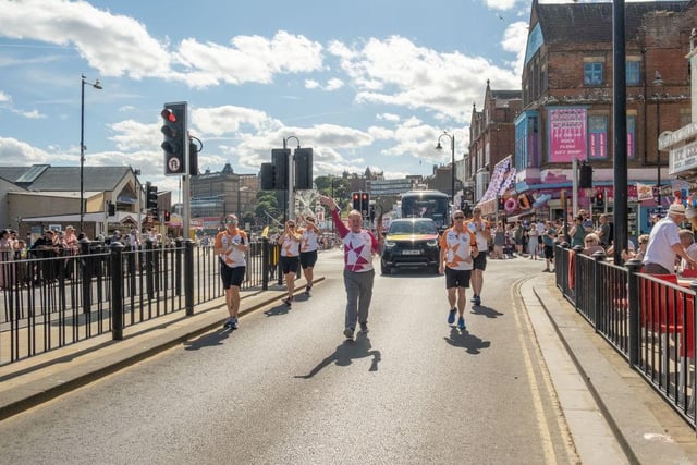 Antony Bakes takes part in The Queen's Baton Relay as it visits Scarborough South Bay.