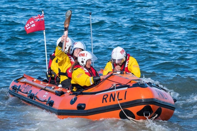 The baton is delivered to the RNLI at Robin Hood's Bay, before making its way to Whitby.