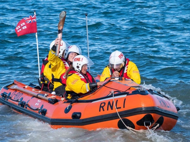 The baton is delivered to the RNLI at Robin Hood's Bay, before making its way to Whitby.