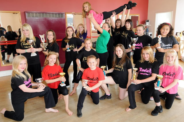Smiles all round as Rowlies dancers are pictured with their trophies.