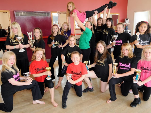 Smiles all round as Rowlies dancers are pictured with their trophies.