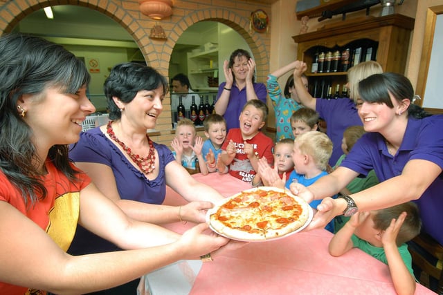 A group from Filey Childcare go to Filey's Bella Italia to learn about pizza making.