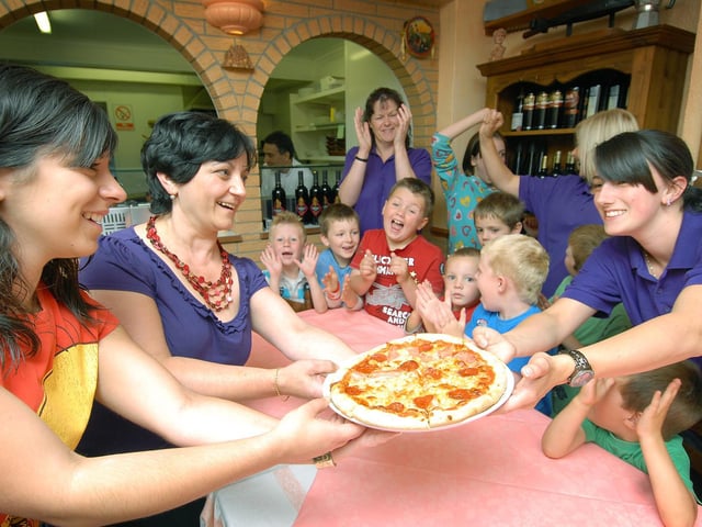 A group from Filey Childcare go to Filey's Bella Italia to learn about pizza making.