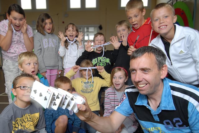 Newby and Scalby Primary School hosts a magic fun day. Pictured is magician Steve Brailsford who shows a card trick to the children.