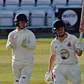 Duncan Brown raises his bat after making it to a superb century

PHOTOS BY SIMON DOBSON