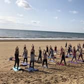People can join a calming and fun early morning family Yoga session on the beach this summer. Photo submitted