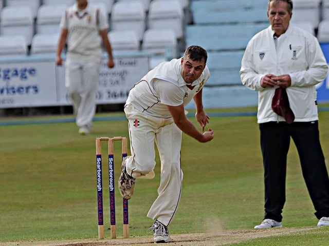 Staxton bowler Andy Holtby steams in