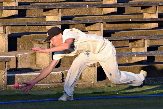 Scarborough fielder Brad Milburn tries to stop another Staxton boundary