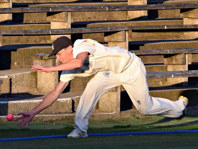 Scarborough fielder Brad Milburn tries to stop another Staxton boundary