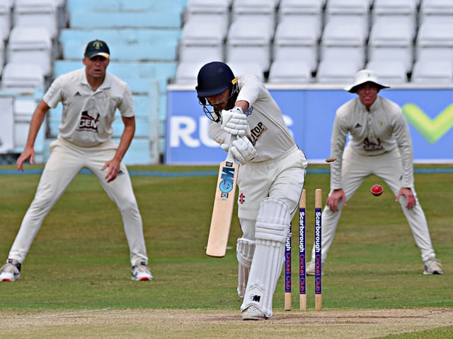 Scarborough CC batter Oli Stephenson falls to a good delivery from Sam Grant