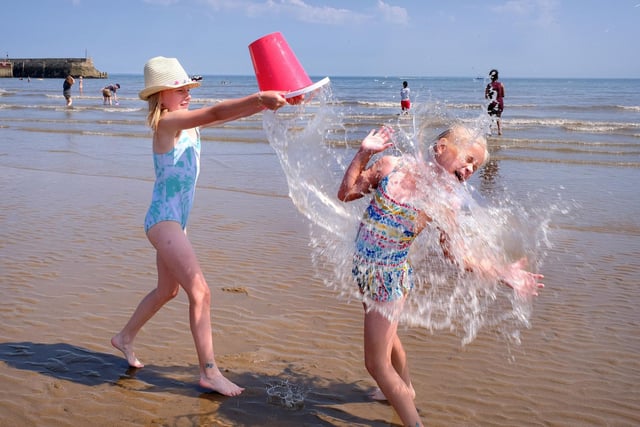 Amelia and Poppy splash, cool off and have fun.