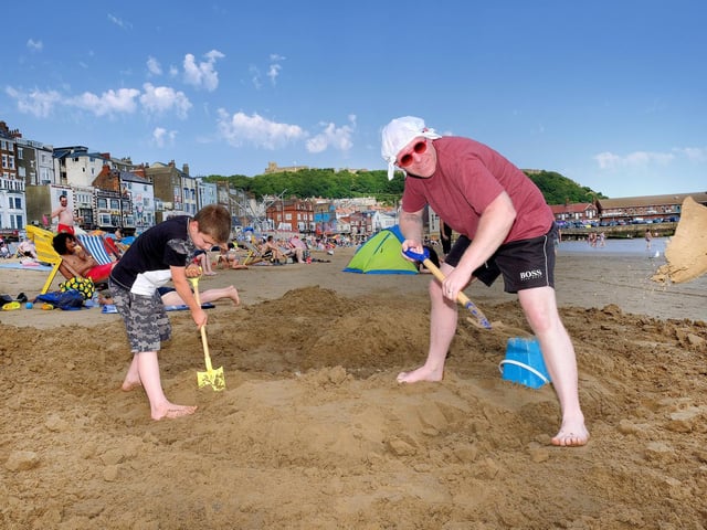 Jack and Dad Rich build a sand castle.