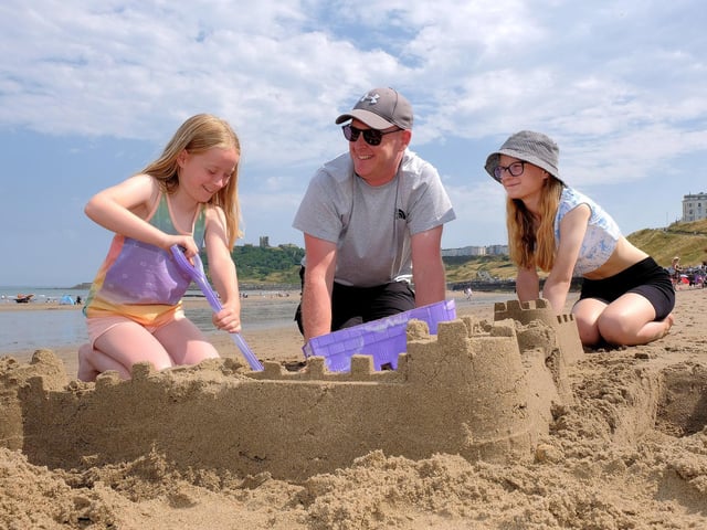 Camryn, Dad Andrew and Brogan build Scarborough Castle on North Bay.