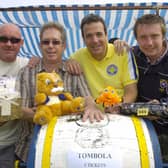 Julian Traves, Vince O’Grady, Steve Foster and Ben Traves look after the tombola stall during the Sewerby Gala and Classic Car show in 2008. Photograph taken by Paul Atkinson. (PA0830-33e)