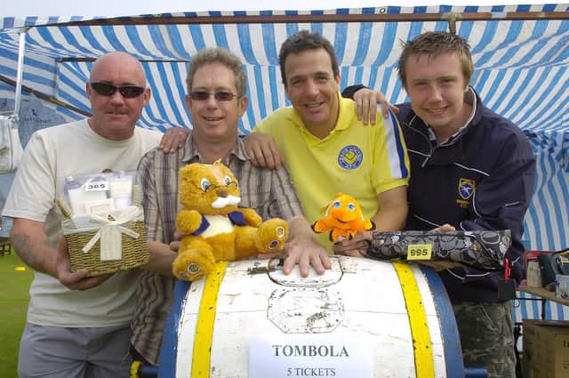 Julian Traves, Vince O’Grady, Steve Foster and Ben Traves look after the tombola stall during the Sewerby Gala and Classic Car show in 2008. Photograph taken by Paul Atkinson. (PA0830-33e)