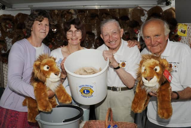 Anne Pouncett, Heather Taylor, Harry Simpson and John Vegeris are pictured at the Lions stall during the Summer Gala in 2010. (PA1030-18c)