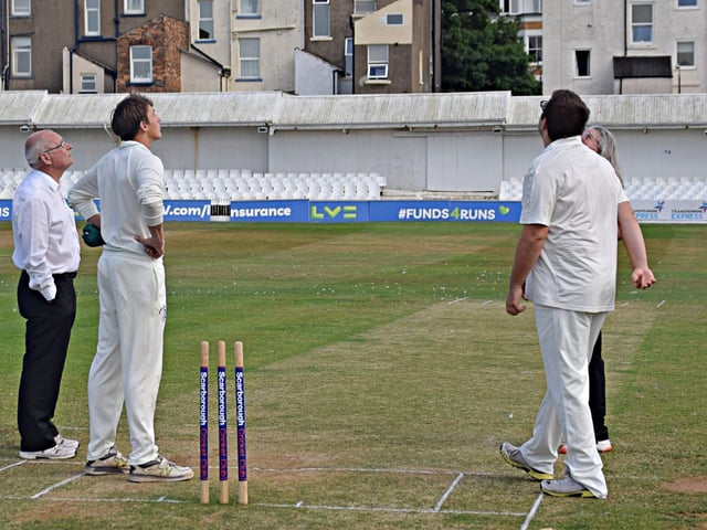 The umpires and captains at the toss for the Hospital Bowl final