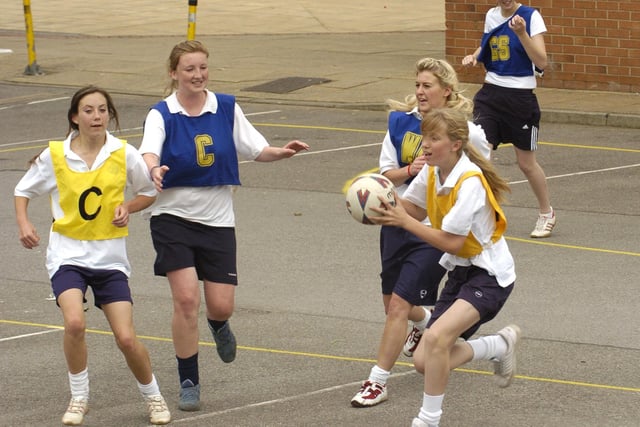 Students compete in a netball match at Whitby Community College's sports day.