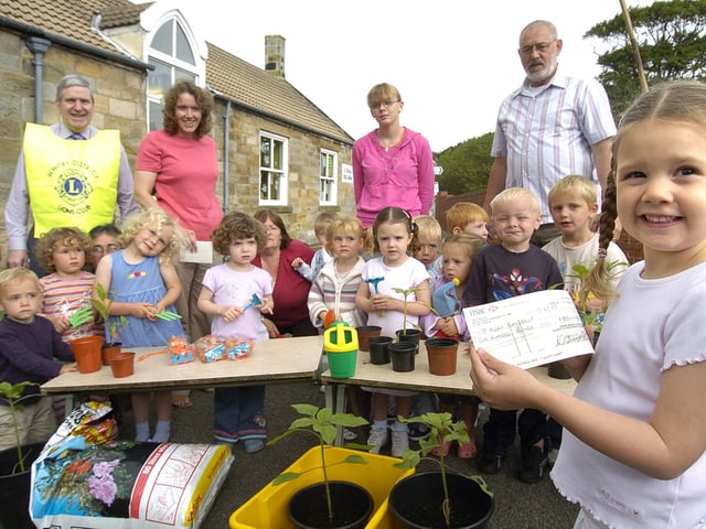 Whitby Lions present Hinderwell Playgroup with a cheque for gardening equipment.