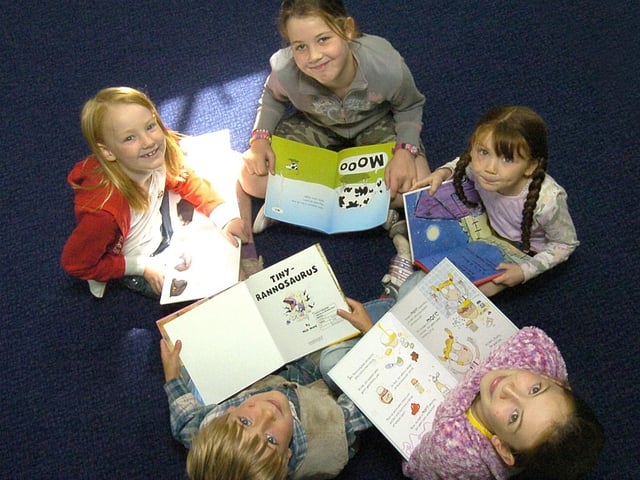 Children from Danby Primary School use the mobile library service as part of the Book Start Week.