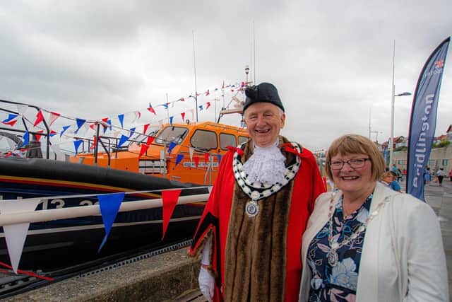 Councillor Mike Heslop-Mullens and his wife Elaine next to the lifeboat. Photo: Mike Milner/RNLI