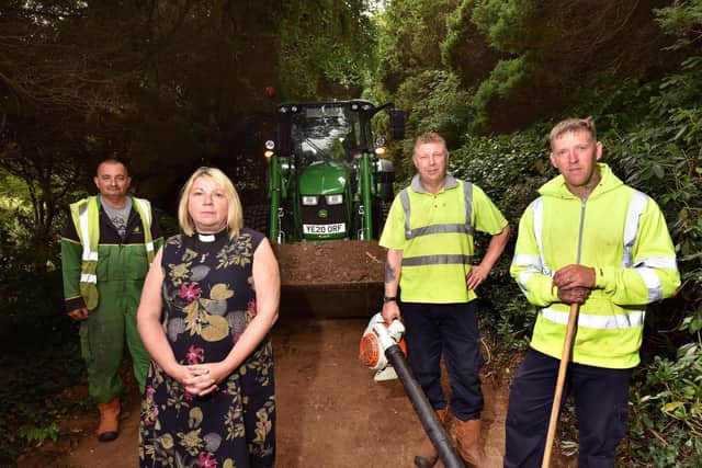 L-R Jason Richardson, Rev Sheena Moray Evans, Darren Peace and John Limb with the cleared debris