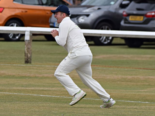 Driffield fielder Alec Drury celebrates catching Prince Bedi in the deep